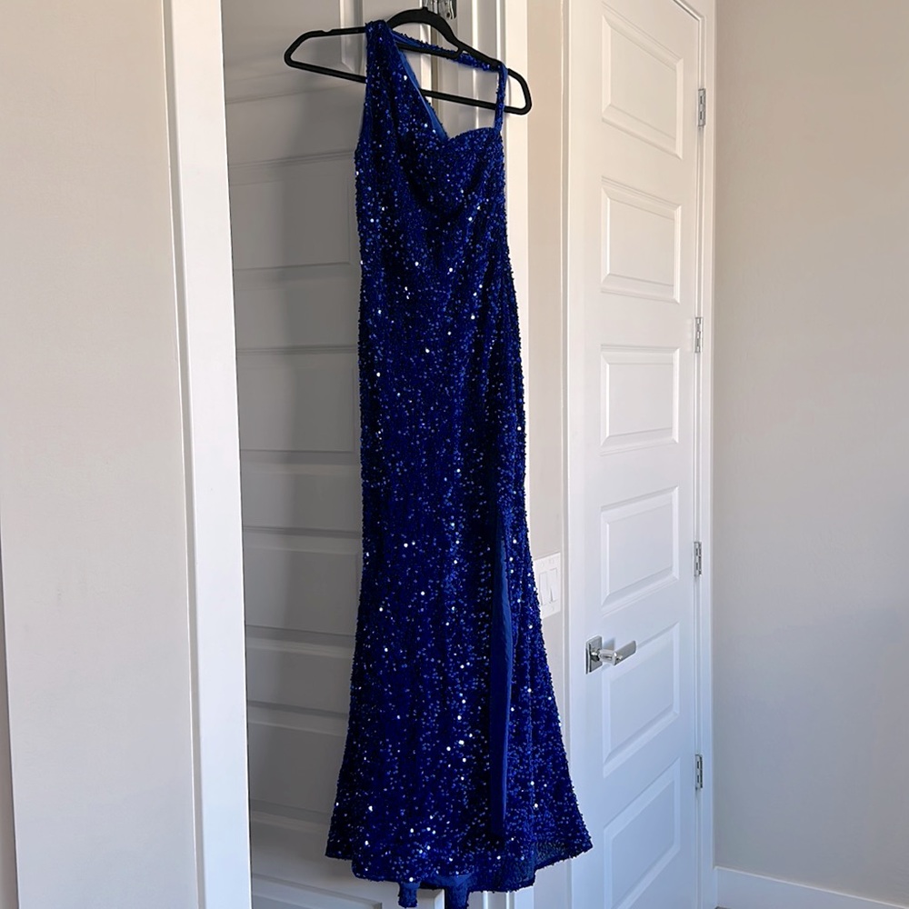 Sequins prom dress. Zip in back. Worn once. Great quality. Body con